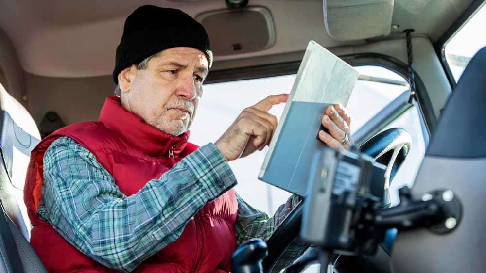 Truck driver using Panasonic Toughbook L1 in cab