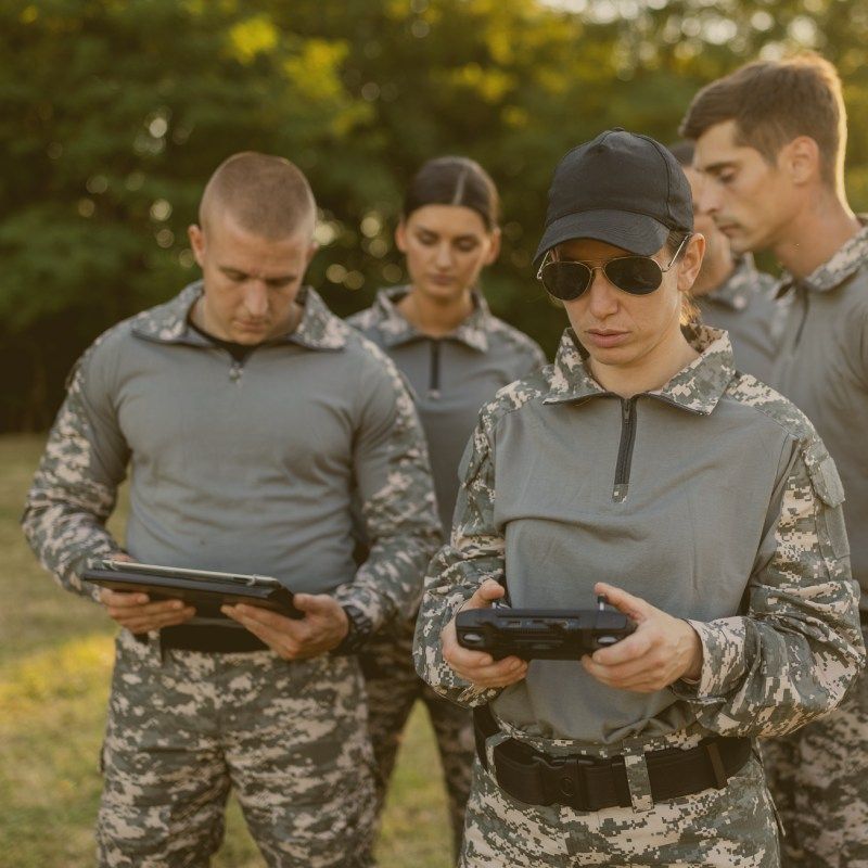 American Military soldiers Using Rugged Tablet for Situational Awareness
