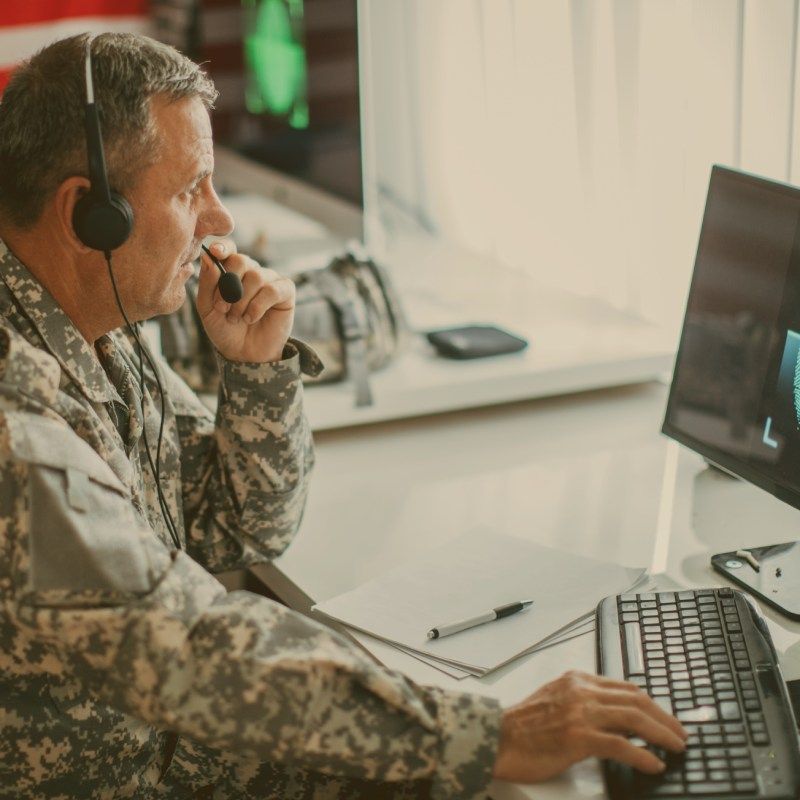 Army officer communicating from headquarters with headset