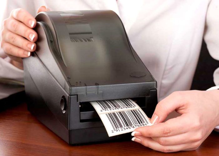 A woman use a barcode printer to print