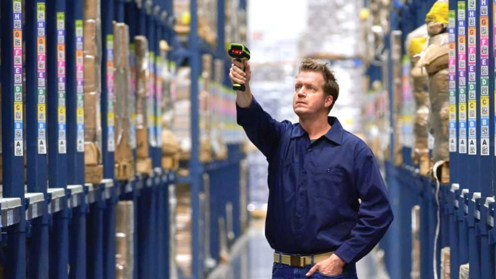 business worker scanning barcode inside the manufacturer site