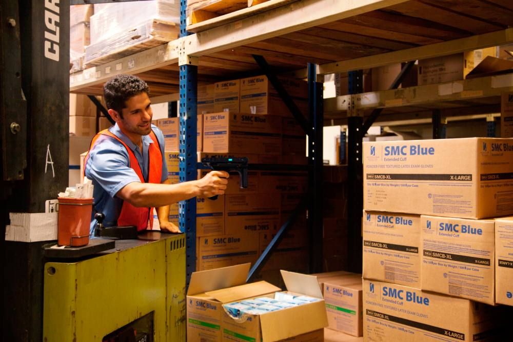 mand using rfid reader for inventory scanning boxes in warehouse