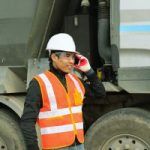 construction worker who answered his phone beside his truck